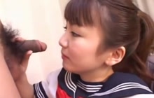 Japanese schoolgirl blowing a cock